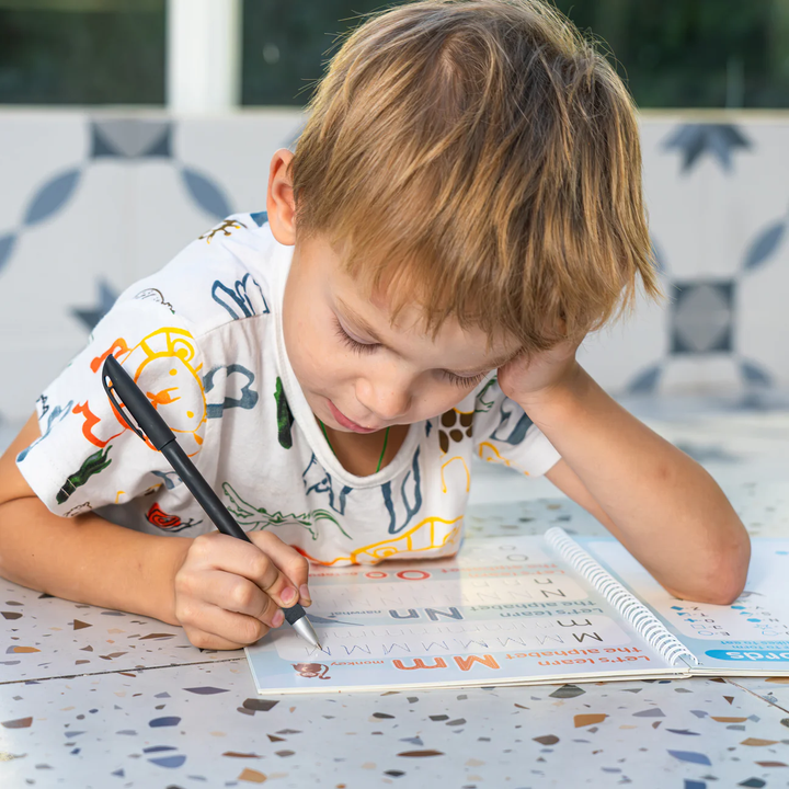 Child focused on handwriting practice
